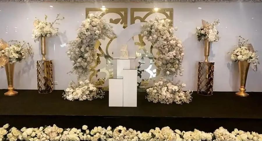 White floral arrangements on a stage