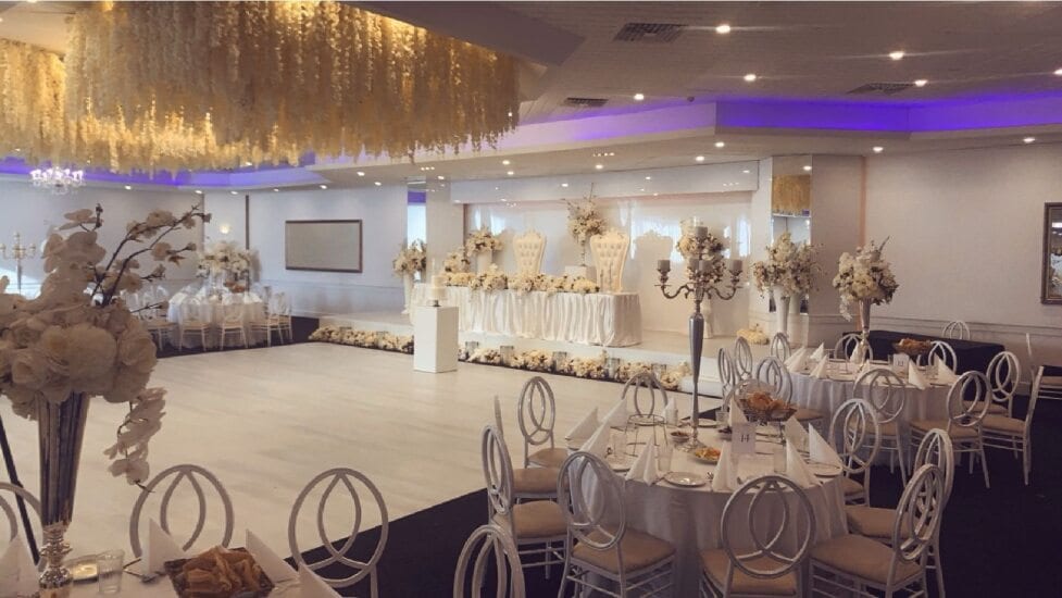 Round tables set for dinner in the Grand Ballroom