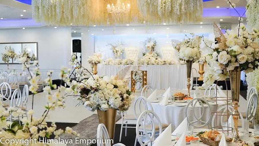 Room dressed with florals around the dance floor