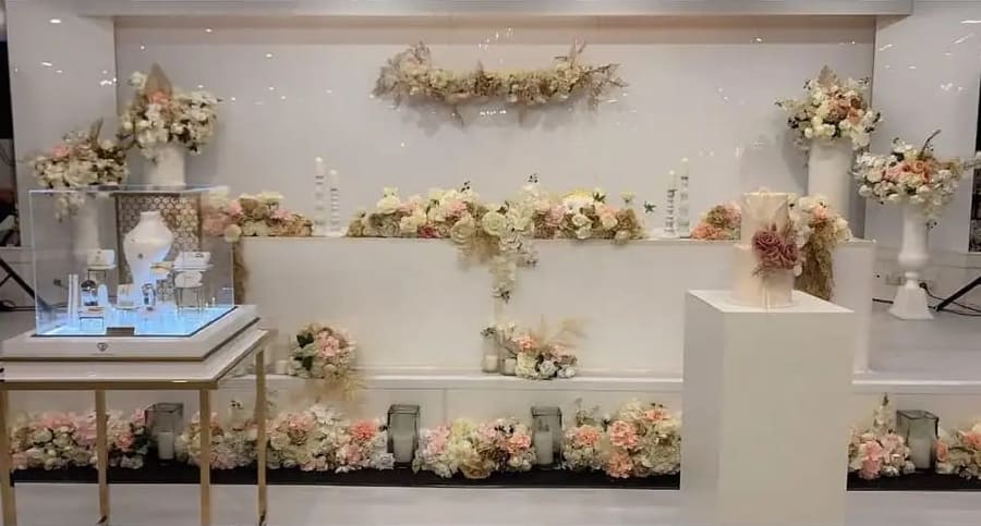 Head table with blush florals and candles