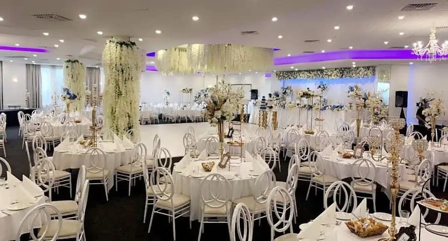 Round tables set under a hanging floral ceiling